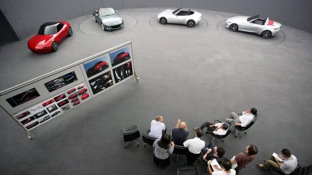 Mazda design team looks over alternative models of the ND MX-5